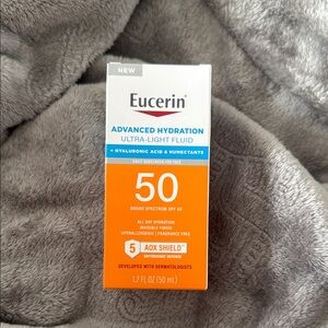 Eucerin Advanced Hydration Ultra-Light Fluid SPF 50 - Orange and White
